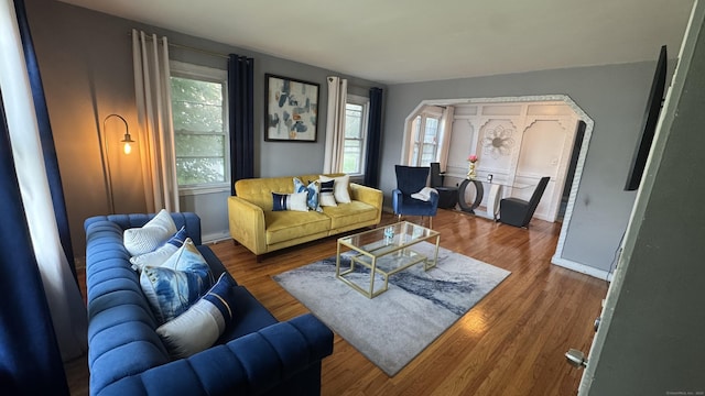 64 Locust St, Bridgeport, CT 06610 - living area with healthy amount of natural light, wood finished floors, and baseboards