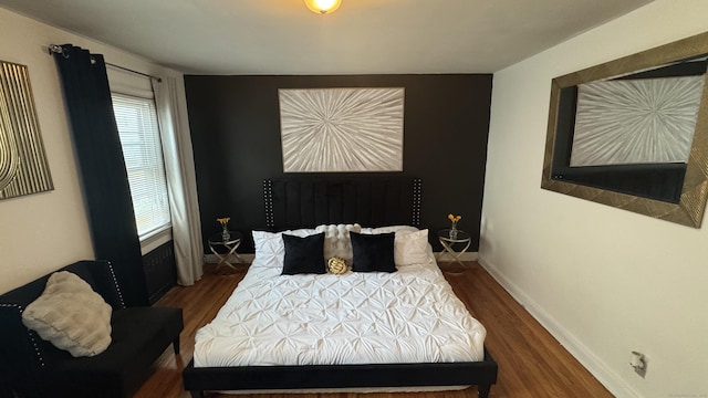 64 Locust St, Bridgeport, CT 06610 - bedroom featuring wood finished floors, multiple windows, and baseboards