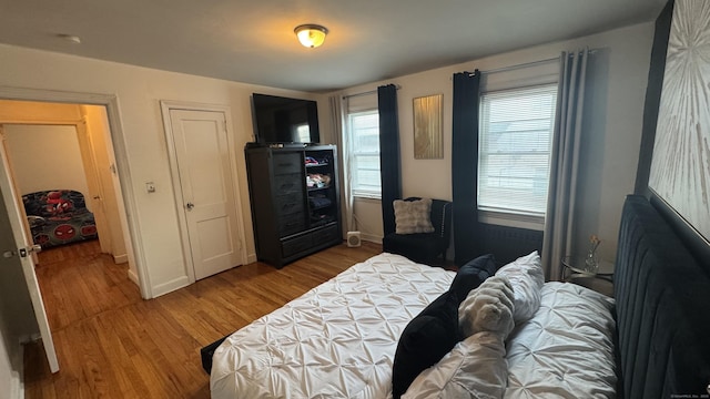 64 Locust St, Bridgeport, CT 06610 - bedroom with wood finished floors and baseboards