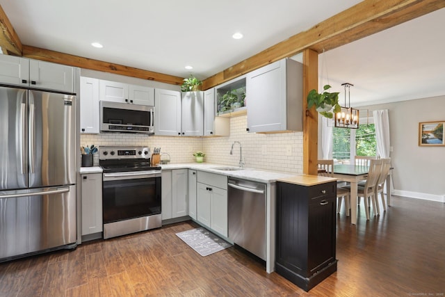 52 Berkshire Dr, Brookfield, CT 06804 - kitchen with stainless steel appliances, a sink, tasteful backsplash, a chandelier, and recessed lighting