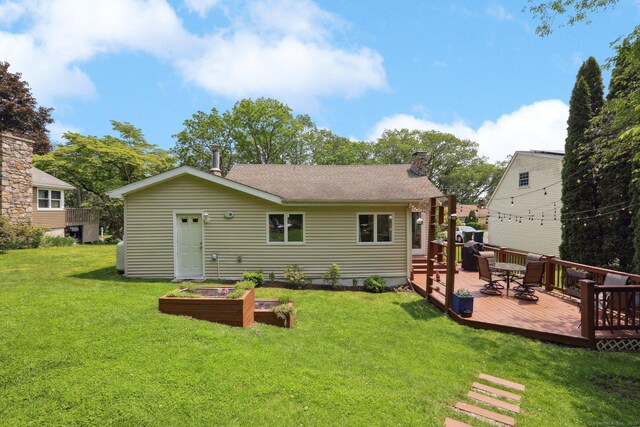52 Berkshire Dr, Brookfield, CT 06804 - back of property featuring a deck, a chimney, a lawn, and a shingled roof