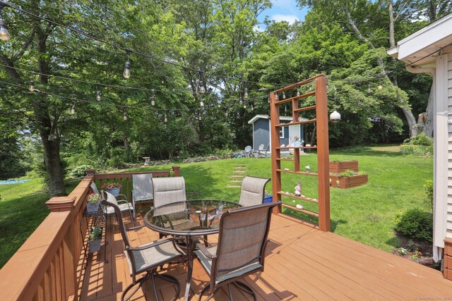 52 Berkshire Dr, Brookfield, CT 06804 - wooden deck featuring outdoor dining area, a yard, and view of scattered trees