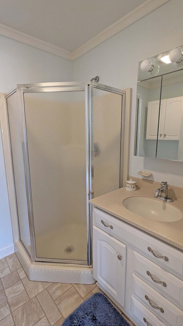 2 Cinnamon Ln Unit 2, Portland, CT 06480 - bathroom featuring ornamental molding, vanity, and a stall shower