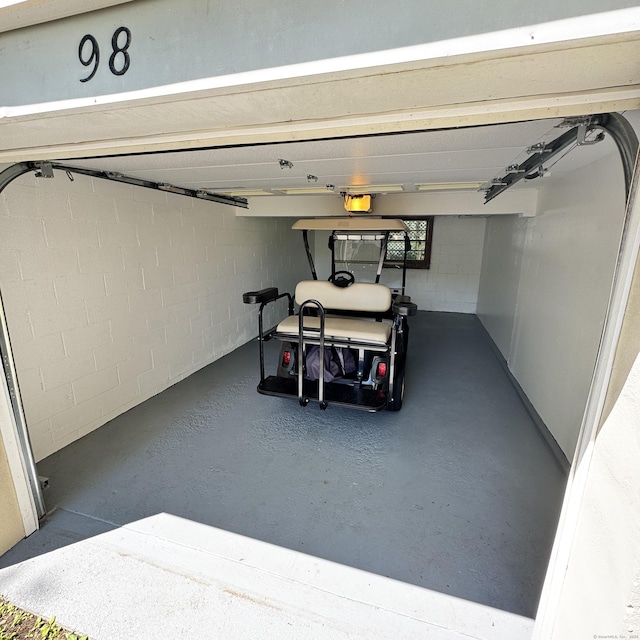 98 N Atwater St, East Haven, CT 06512 - garage with concrete block wall and a garage door opener