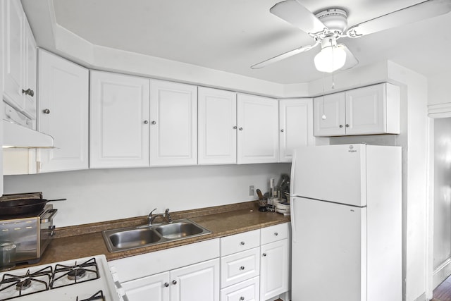 165 Connecticut Ave, New London, CT 06320 - kitchen with white appliances, a sink, white cabinets, and dark countertops