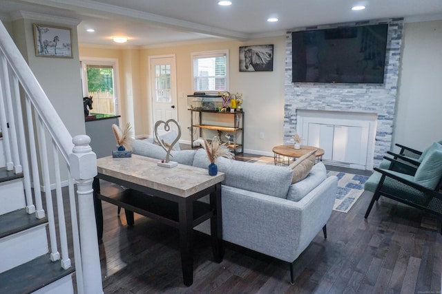 381 Oak St, East Hartford, CT 06118 - living area featuring ornamental molding, wood finished floors, stairs, a stone fireplace, and recessed lighting