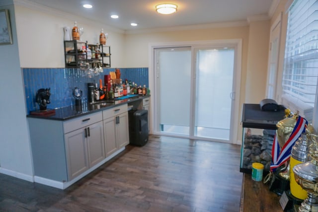 381 Oak St, East Hartford, CT 06118 - indoor bar featuring ornamental molding, dark wood finished floors, decorative backsplash, recessed lighting, and baseboards