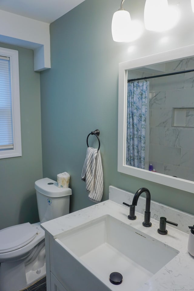 381 Oak St, East Hartford, CT 06118 - bathroom featuring vanity, toilet, and a shower with shower curtain