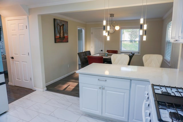 381 Oak St, East Hartford, CT 06118 - kitchen with white range with gas cooktop, ornamental molding, light stone counters, white cabinets, and a peninsula