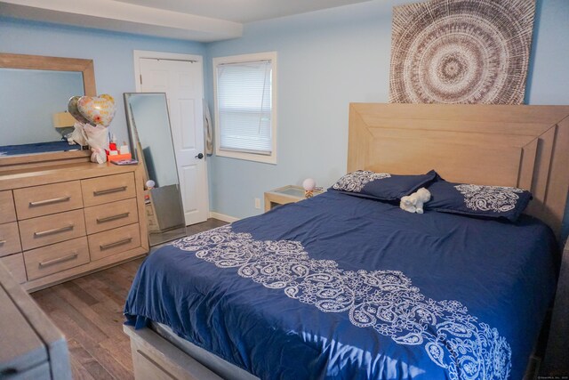 381 Oak St, East Hartford, CT 06118 - bedroom with dark wood-style flooring
