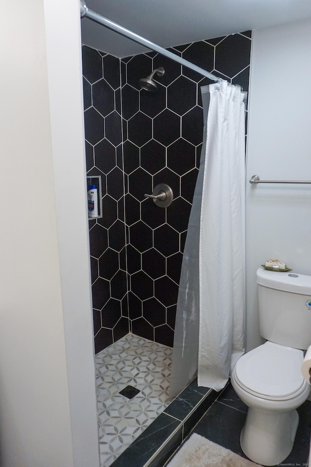381 Oak St, East Hartford, CT 06118 - bathroom with toilet, a stall shower, and tile patterned floors