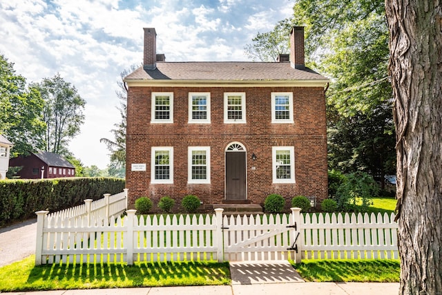 132 Broad St, Wethersfield, CT 06109 - view of front of house featuring brick siding and a chimney