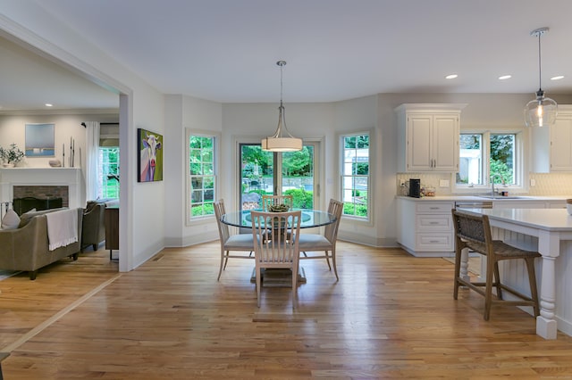 38 Old Trolley Rd, Ridgefield, CT 06877 - dining space featuring light wood-style floors, recessed lighting, baseboards, and a fireplace