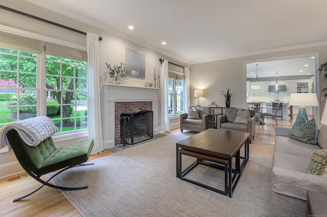 38 Old Trolley Rd, Ridgefield, CT 06877 - living area featuring wood finished floors, ornamental molding, a fireplace, recessed lighting, and baseboards