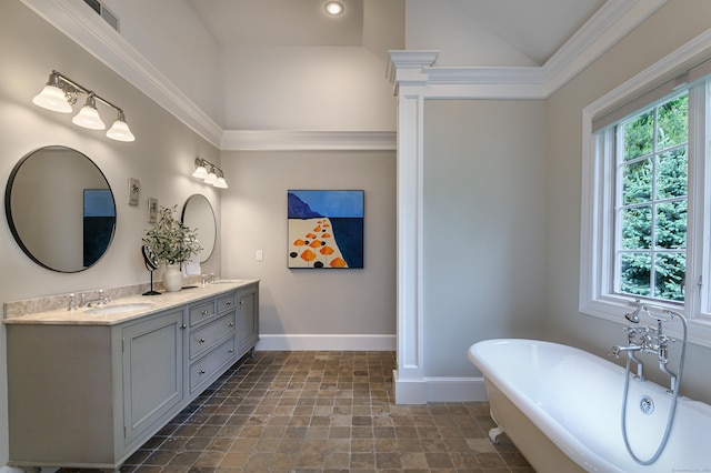 38 Old Trolley Rd, Ridgefield, CT 06877 - full bathroom featuring baseboards, double vanity, a freestanding tub, and stone finish flooring
