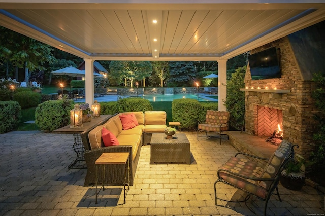 38 Old Trolley Rd, Ridgefield, CT 06877 - view of patio with an outdoor living space with a fireplace and an outdoor pool