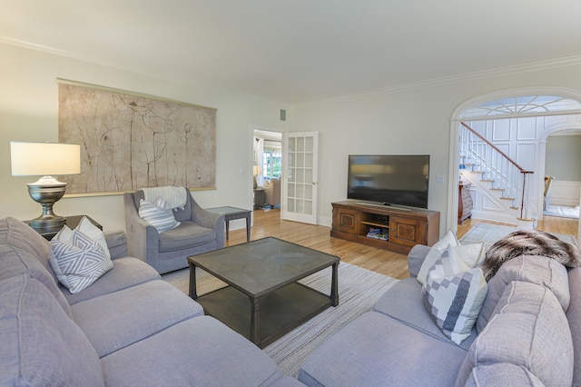 38 Old Trolley Rd, Ridgefield, CT 06877 - living room with stairway, arched walkways, crown molding, and wood finished floors