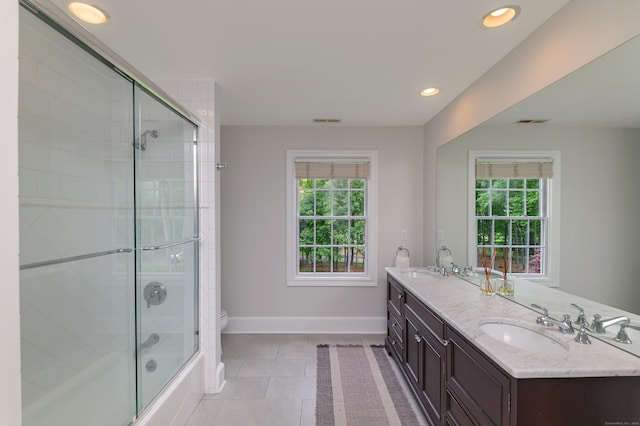 38 Old Trolley Rd, Ridgefield, CT 06877 - bathroom featuring double vanity, toilet, baseboards, tile patterned floors, and enclosed tub / shower combo