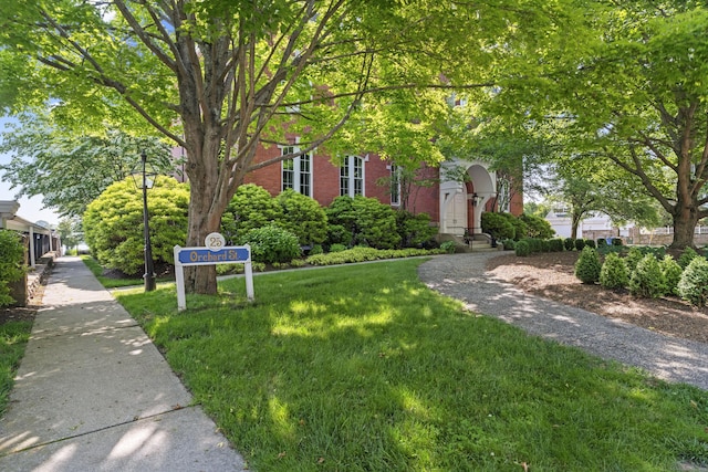25 Orchard St Unit 14, Stonington, CT 06378 - obstructed view of property featuring brick siding and a front yard