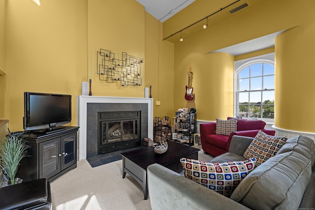 25 Orchard St Unit 14, Stonington, CT 06378 - living area with rail lighting, carpet flooring, and a tiled fireplace