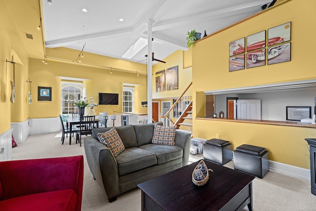 25 Orchard St Unit 14, Stonington, CT 06378 - living area featuring carpet flooring, beam ceiling, high vaulted ceiling, and stairway