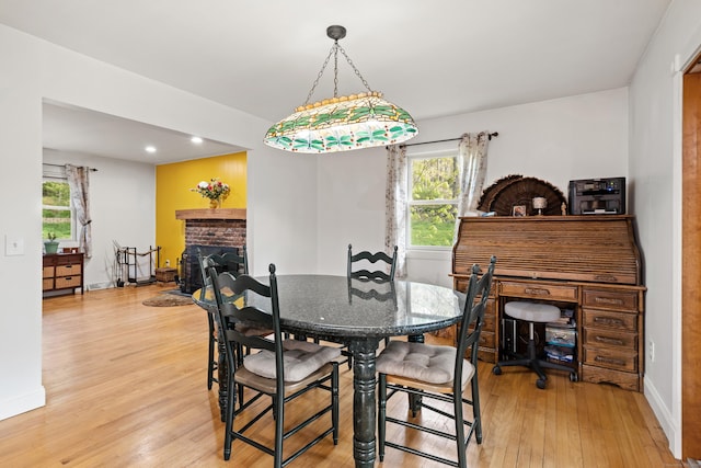 2 Pine Hill Rd, New Fairfield, CT 06812 - dining room featuring light wood-style flooring, a brick fireplace, healthy amount of natural light, baseboards, and recessed lighting