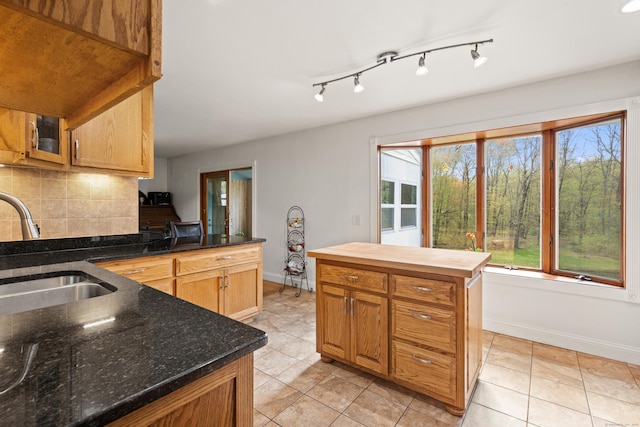 2 Pine Hill Rd, New Fairfield, CT 06812 - kitchen with a sink, baseboards, light tile patterned flooring, and tasteful backsplash