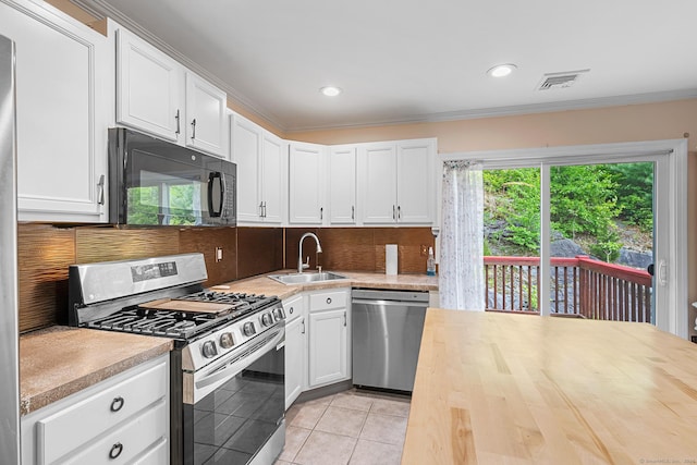 142 Summit St Unit 142, Norwich, CT 06360 - kitchen with stainless steel appliances, a sink, tasteful backsplash, crown molding, and white cabinets
