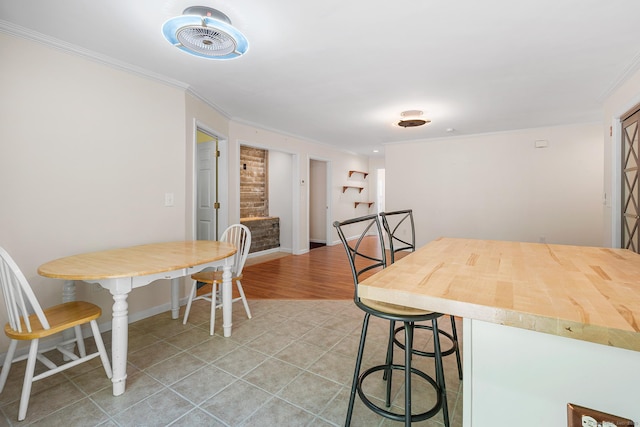 142 Summit St Unit 142, Norwich, CT 06360 - dining space with crown molding, stairs, baseboards, and light tile patterned floors
