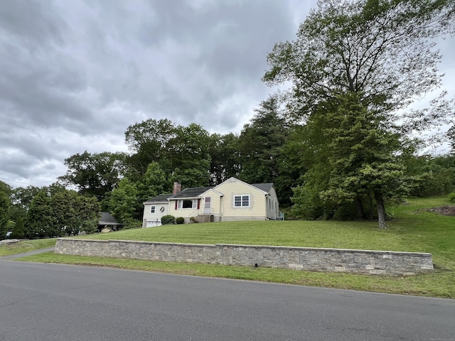 39 Eastwood Rd, Bristol, CT 06010 - view of front of house with a front yard and a chimney