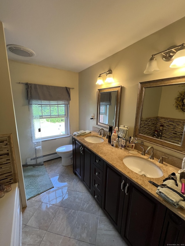 39 Eastwood Rd, Bristol, CT 06010 - full bath featuring double vanity, toilet, and baseboard heating
