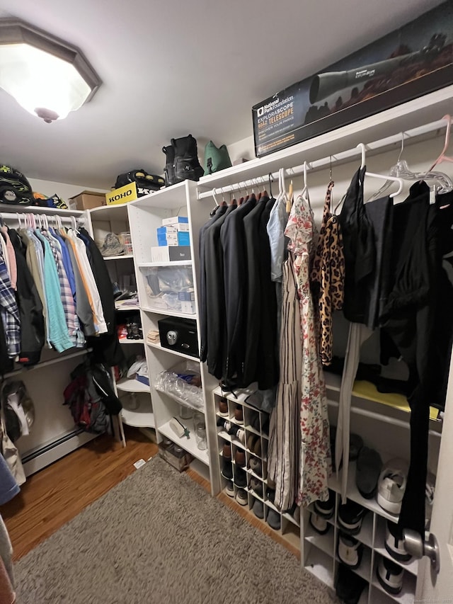 39 Eastwood Rd, Bristol, CT 06010 - walk in closet with wood finished floors and a baseboard radiator