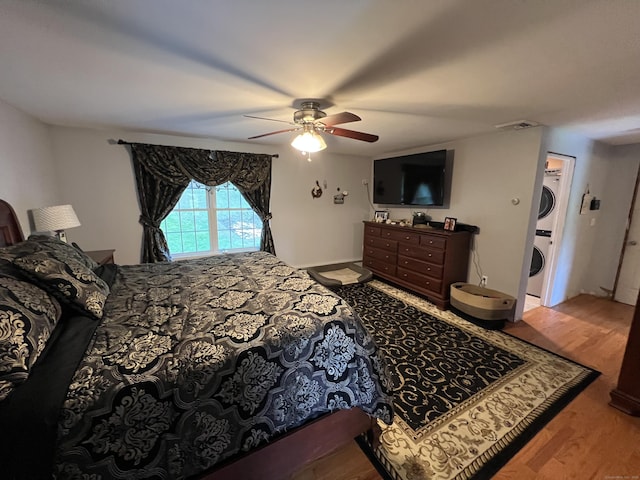 39 Eastwood Rd, Bristol, CT 06010 - bedroom with stacked washer / drying machine, wood finished floors, and ceiling fan
