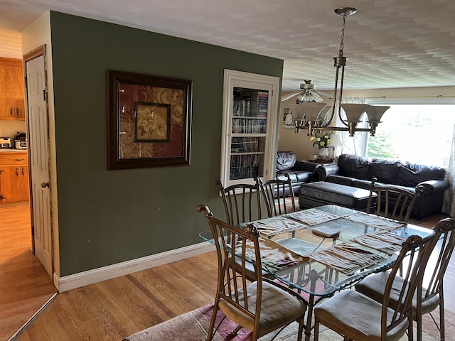 39 Eastwood Rd, Bristol, CT 06010 - dining area featuring light wood finished floors, a ceiling fan, and baseboards