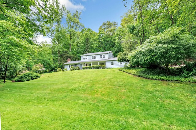 6 Rivergate Woods, Wilton, CT 06897 - view of green lawn with a wooded view