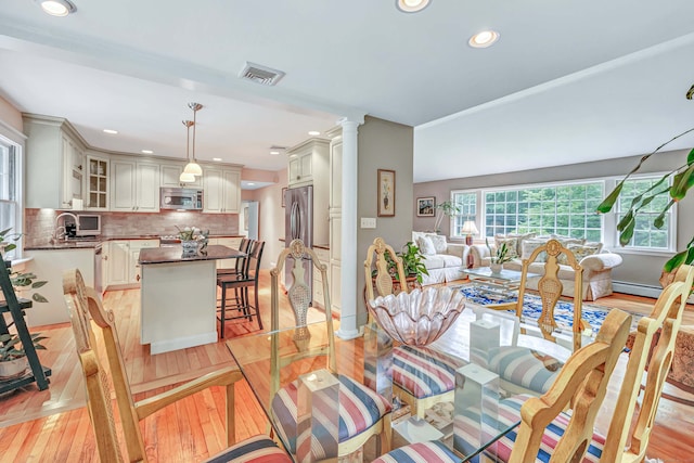 6 Rivergate Woods, Wilton, CT 06897 - dining area featuring recessed lighting, ornate columns, light wood-style flooring, and baseboards