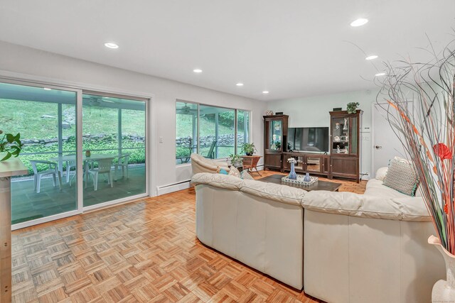 6 Rivergate Woods, Wilton, CT 06897 - living room featuring a baseboard heating unit, recessed lighting, and plenty of natural light