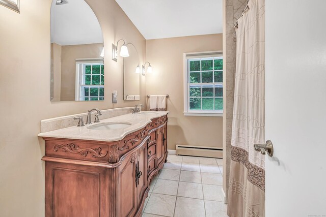 6 Rivergate Woods, Wilton, CT 06897 - bathroom featuring a baseboard heating unit, double vanity, tile patterned flooring, and baseboards