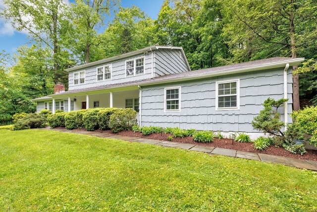 6 Rivergate Woods, Wilton, CT 06897 - view of front facade featuring a front lawn