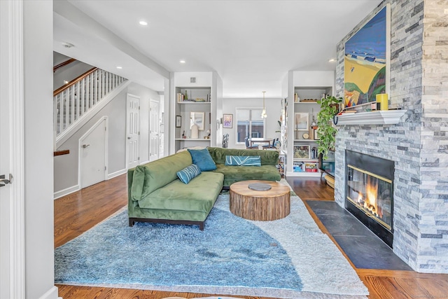40 Temple Ct Unit 40, New Haven, CT 06511 - living room with wood finished floors, a stone fireplace, stairs, and recessed lighting