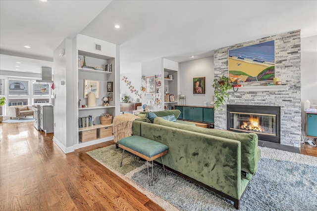 40 Temple Ct Unit 40, New Haven, CT 06511 - living room with wood finished floors, a fireplace, built in shelves, and recessed lighting