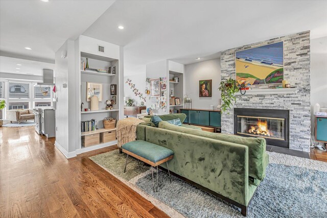 40 Temple Ct Unit 40, New Haven, CT 06511 - living room with wood finished floors, a fireplace, built in shelves, and recessed lighting