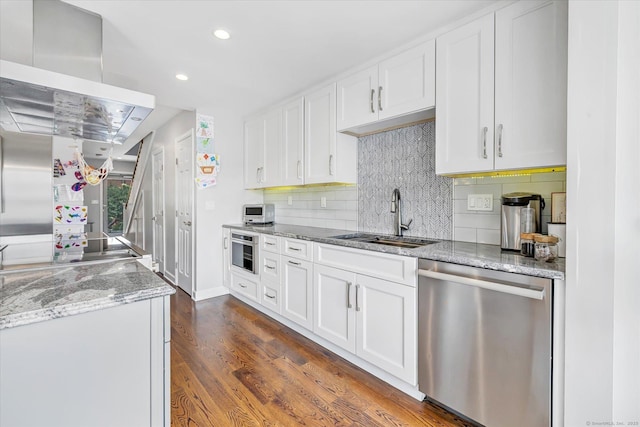 40 Temple Ct Unit 40, New Haven, CT 06511 - kitchen with dishwasher, wall chimney range hood, decorative backsplash, white cabinets, and dark wood-style floors