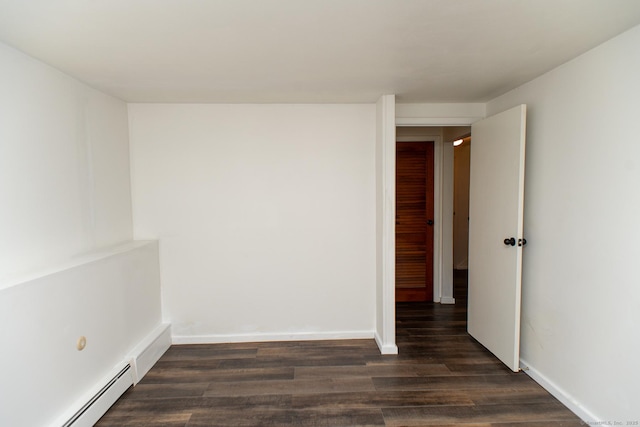 498 Long Hill Ave, Shelton, CT 06484 - unfurnished room featuring a baseboard heating unit, dark wood finished floors, and baseboards