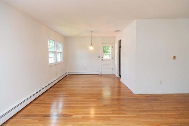 498 Long Hill Ave, Shelton, CT 06484 - empty room featuring a baseboard heating unit, light wood-type flooring, plenty of natural light, and baseboards