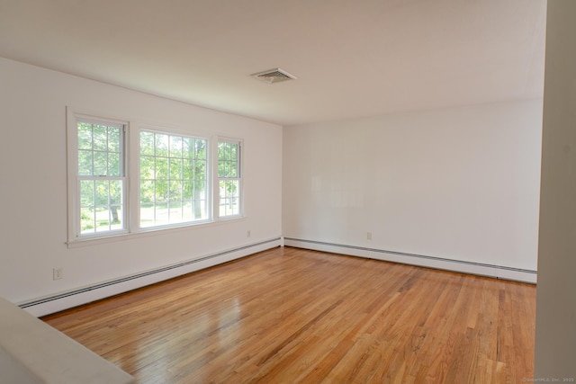 498 Long Hill Ave, Shelton, CT 06484 - empty room with wood finished floors, a baseboard radiator, and baseboard heating