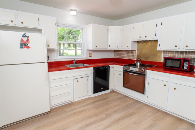 498 Long Hill Ave, Shelton, CT 06484 - kitchen featuring freestanding refrigerator, black dishwasher, a sink, range, and light wood-type flooring
