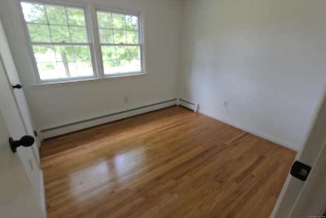 498 Long Hill Ave, Shelton, CT 06484 - unfurnished room featuring a baseboard radiator and wood finished floors