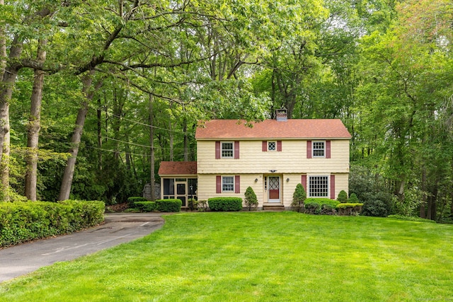 10 Laurel Glen Dr, East Hampton, CT 06424 - colonial-style house with a chimney and a front yard