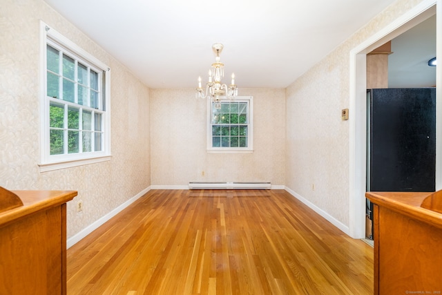 10 Laurel Glen Dr, East Hampton, CT 06424 - unfurnished dining area with wood-type flooring, baseboard heating, a chandelier, baseboards, and wallpapered walls